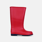 A red classic wellington boot with a navy blue sole is displayed on a white background.